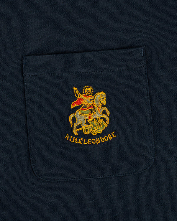Saint George Slub Pocket Tee: Navy pocket tee with an embroidered knight slaying a dragon and AIME LEON DORE text.