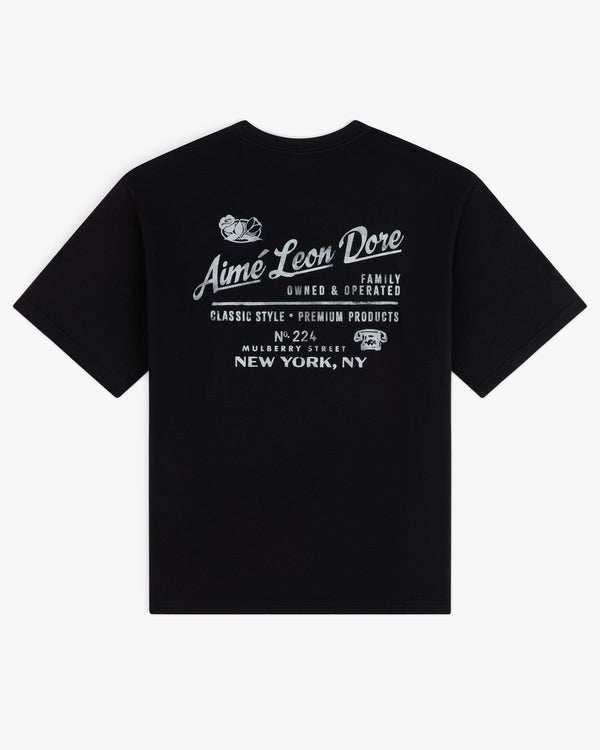 Black Neighborhood Tee with white Aimé Leon Dore, New York, NY text and distinctive graphic design elements.