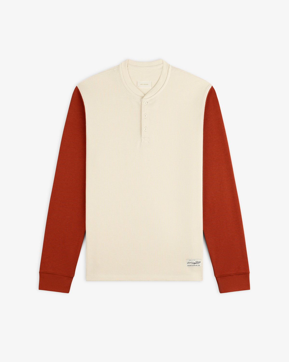 Long-Sleeve Waffle Henley with a cream-colored torso and rust-colored sleeves.