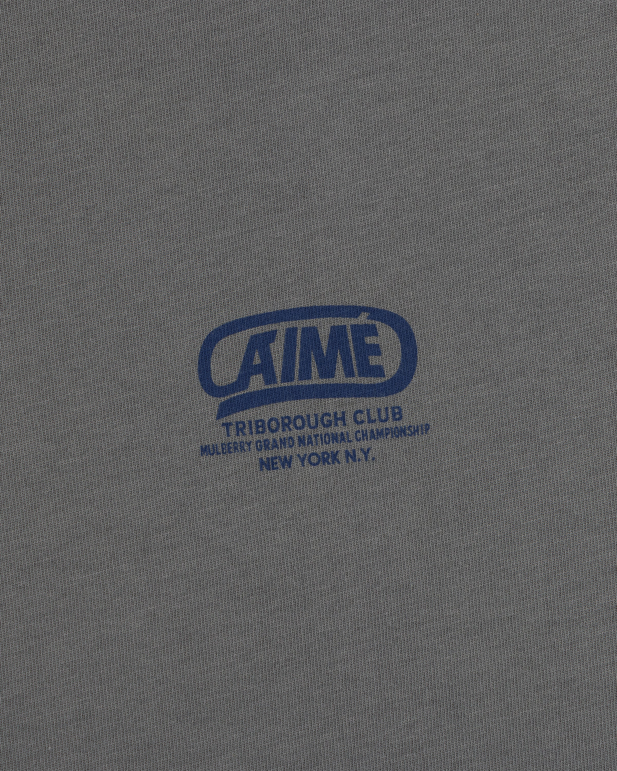 Grey Triborough Club Tee with a blue graphic reading Aime Triborough Club Mulberry Grand National Championship New York N.Y.