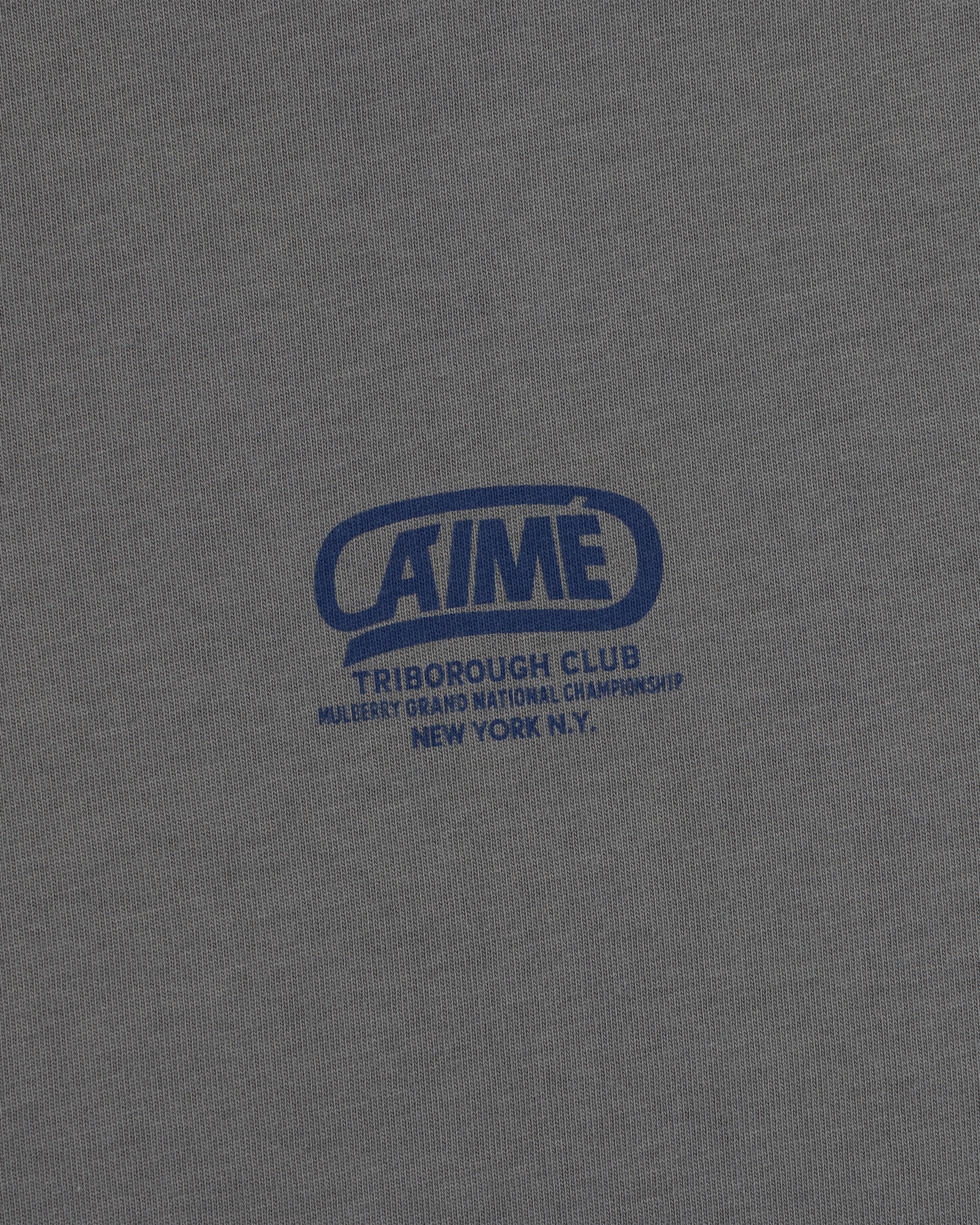 Grey Triborough Club Tee with a blue graphic reading Aime Triborough Club Mulberry Grand National Championship New York N.Y.