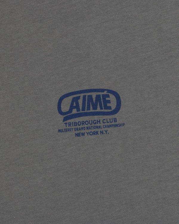 Grey Triborough Club Tee with a blue graphic reading Aime Triborough Club Mulberry Grand National Championship New York N.Y.