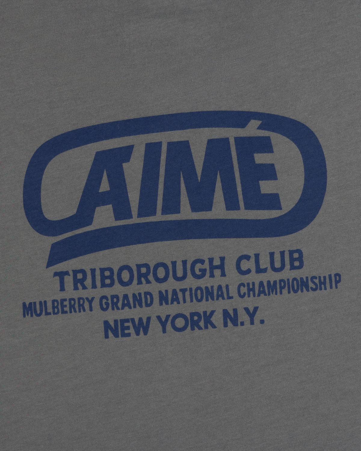 Grey Triborough Club Tee with a blue graphic reading AIMÉ TRIBOROUGH CLUB MULBERRY GRAND NATIONAL CHAMPIONSHIP NEW YORK N.Y.