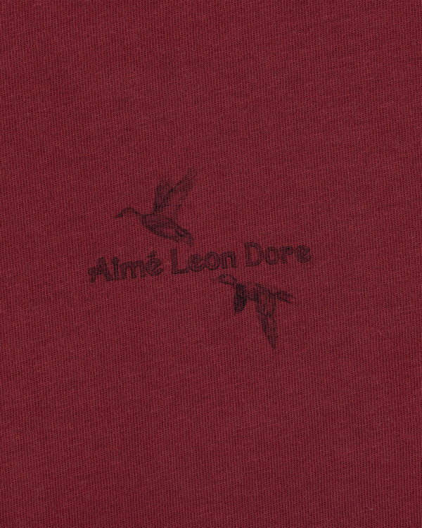 Maroon Long-Sleeve Retriever Tee featuring a black graphic of two flying ducks and the brand name in the center.
