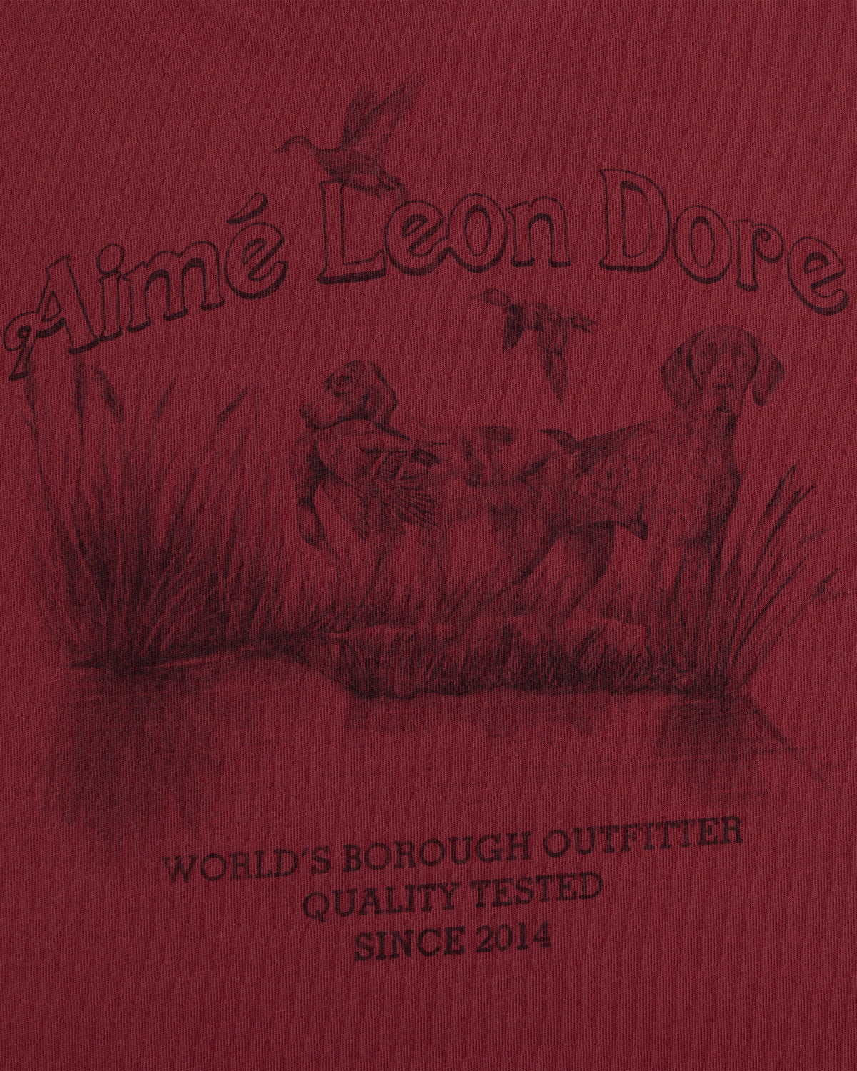 Dark red Long-Sleeve Retriever Tee featuring a graphic of two dogs in tall grass, flying ducks, and Aimé Leon Dore text.