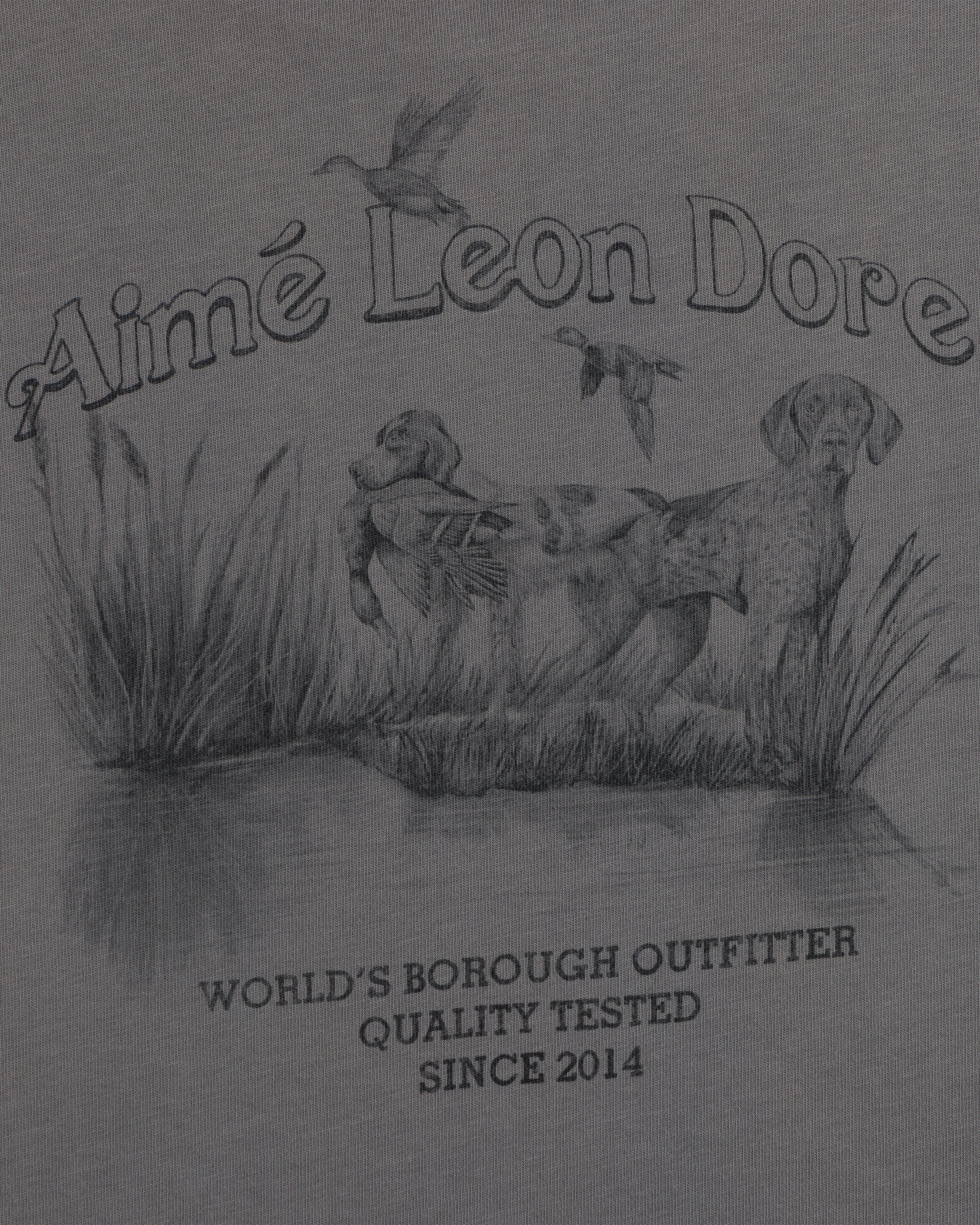 Graphite illustration of a hunting dog in a marsh with birds on a Long-Sleeve Retriever Tee with printed text.