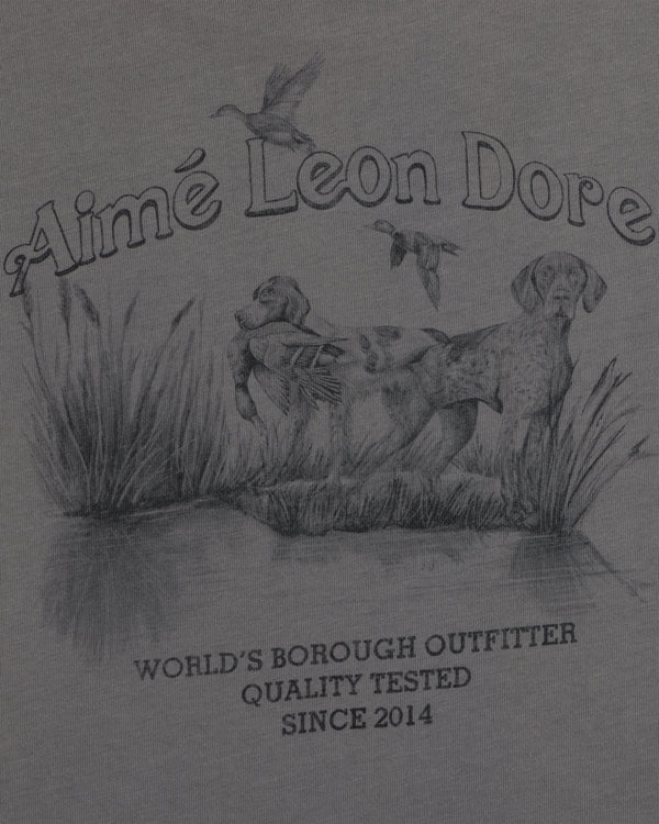 Graphite illustration of a hunting dog in a marsh with birds on a Long-Sleeve Retriever Tee with printed text.