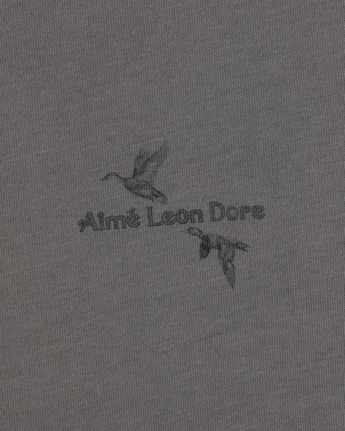 Long-Sleeve Retriever Tee featuring two ducks in flight with Aimé Leon Dore text on grey fabric.