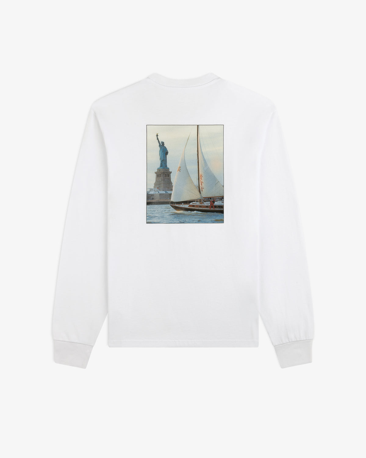 White Long-Sleeve Sailing Tee with a back graphic of a sailboat passing the Statue of Liberty.