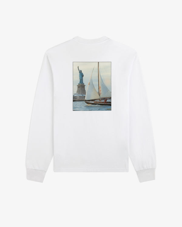 White Long-Sleeve Sailing Tee with a back graphic of a sailboat passing the Statue of Liberty.