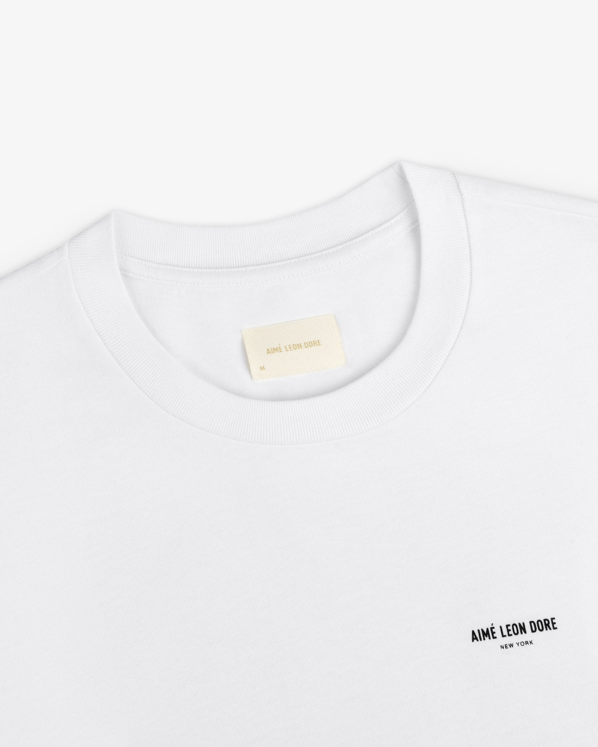 White Long-Sleeve Sailing Tee with a small logo on the chest and an inner neckline size label.