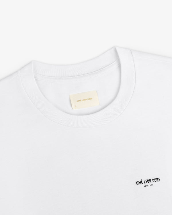 White Long-Sleeve Sailing Tee with a small logo on the chest and an inner neckline size label.