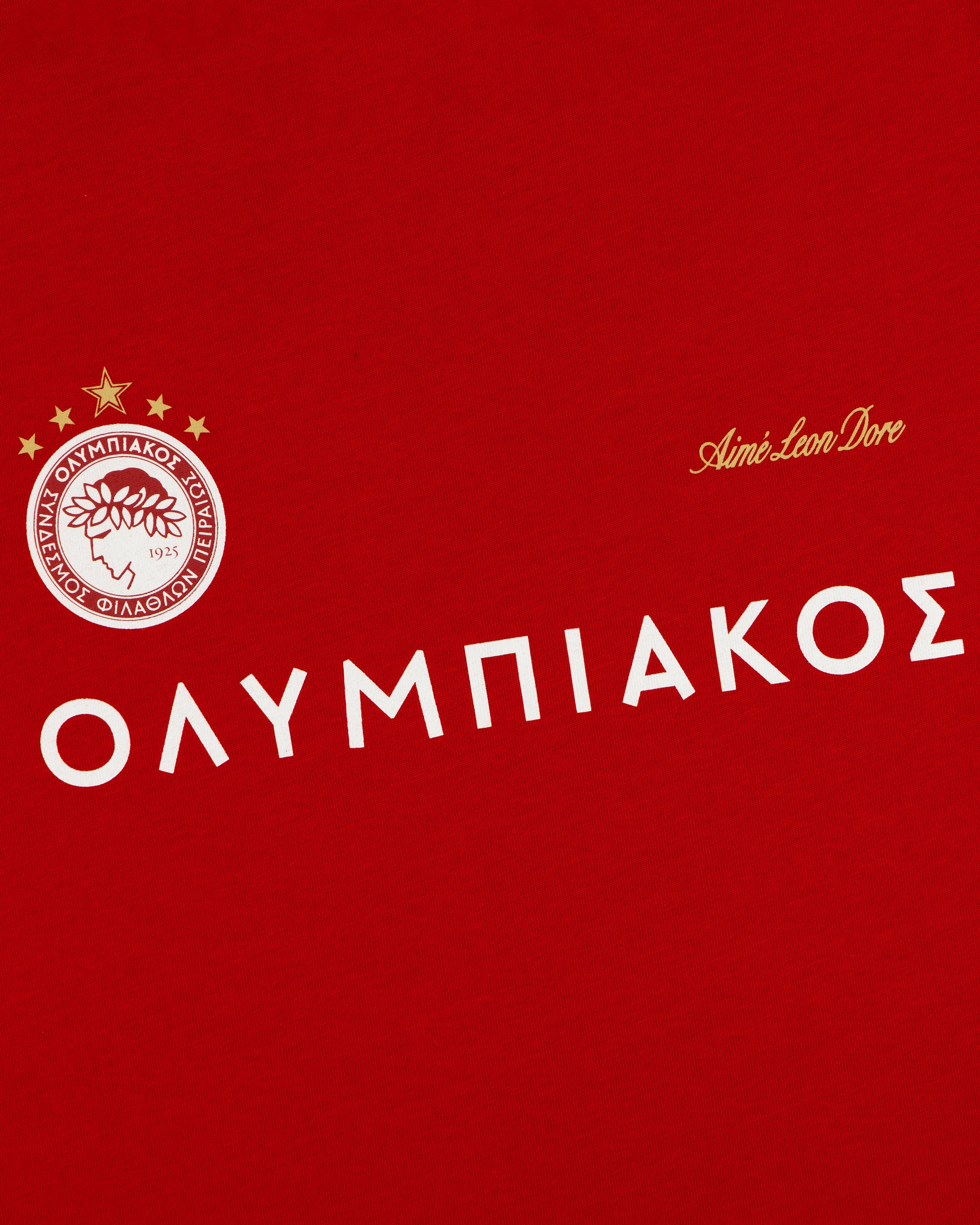 Red ALD / Olympiacos F.C. Souvenir Tee featuring the team crest, name in Greek, and a script logo.