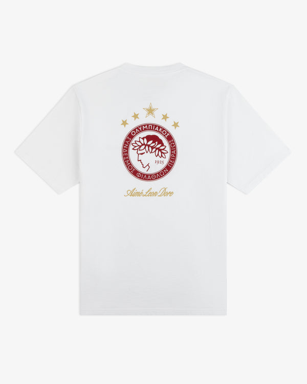 White ALD / Olympiacos F.C. Souvenir Tee featuring the team crest and Aimé Leon Dore text on the back.