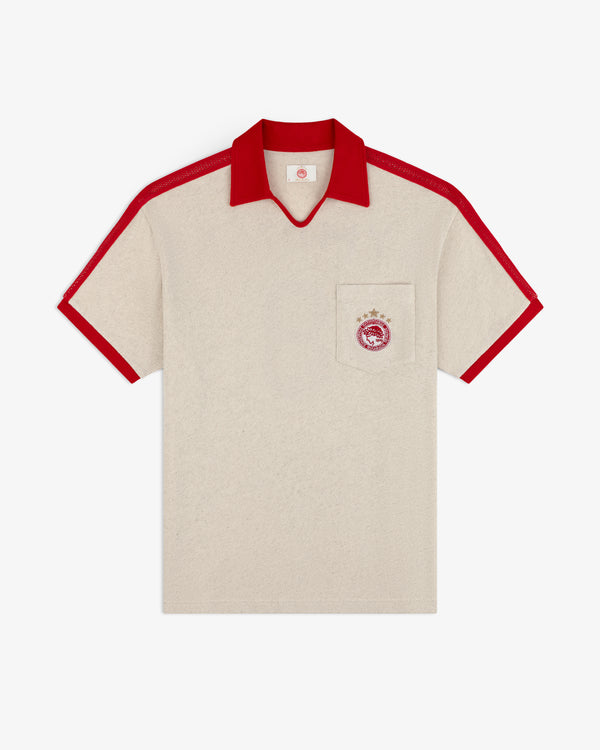 Off-white short-sleeved ALD / Olympiacos F.C. Heritage Ringer Polo with red collar, trim, and chest pocket soccer crest.