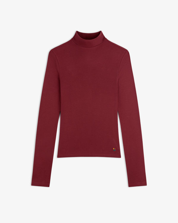 Maroon Ribbed Mockneck Long-Sleeve Tee with a small flower detail at the hip.