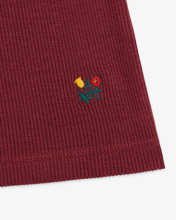 Ribbed Mockneck Long-Sleeve Tee in maroon ribbed fabric with a small embroidered floral design.