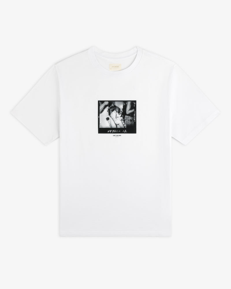 The Esco Tee is a white short-sleeve t-shirt with a square black and white photographic print on the chest.