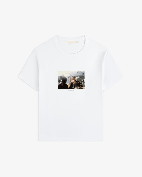 Agóri Photo Tee: a white t-shirt featuring a rectangular graphic of people sitting at an outdoor table.