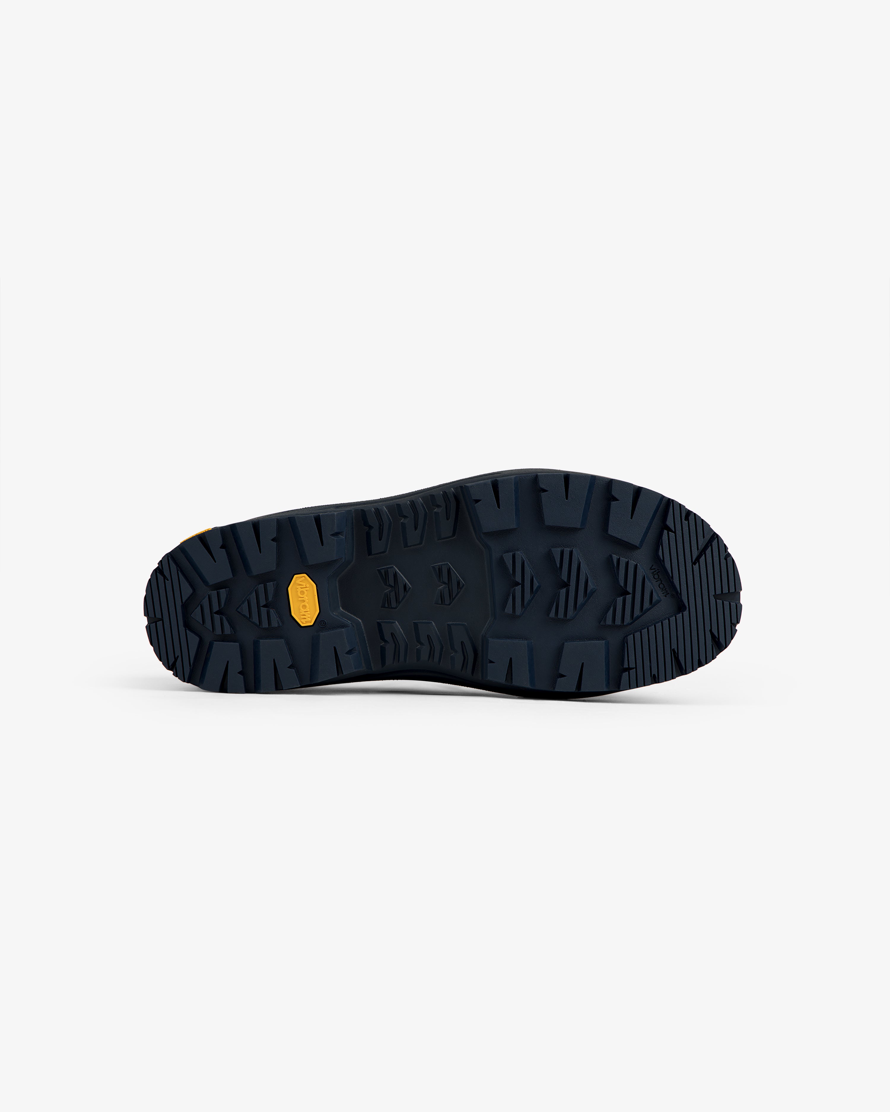 Dark blue ALD/The North Face Base Camp Mule sole with rugged tread and small yellow label at the center.