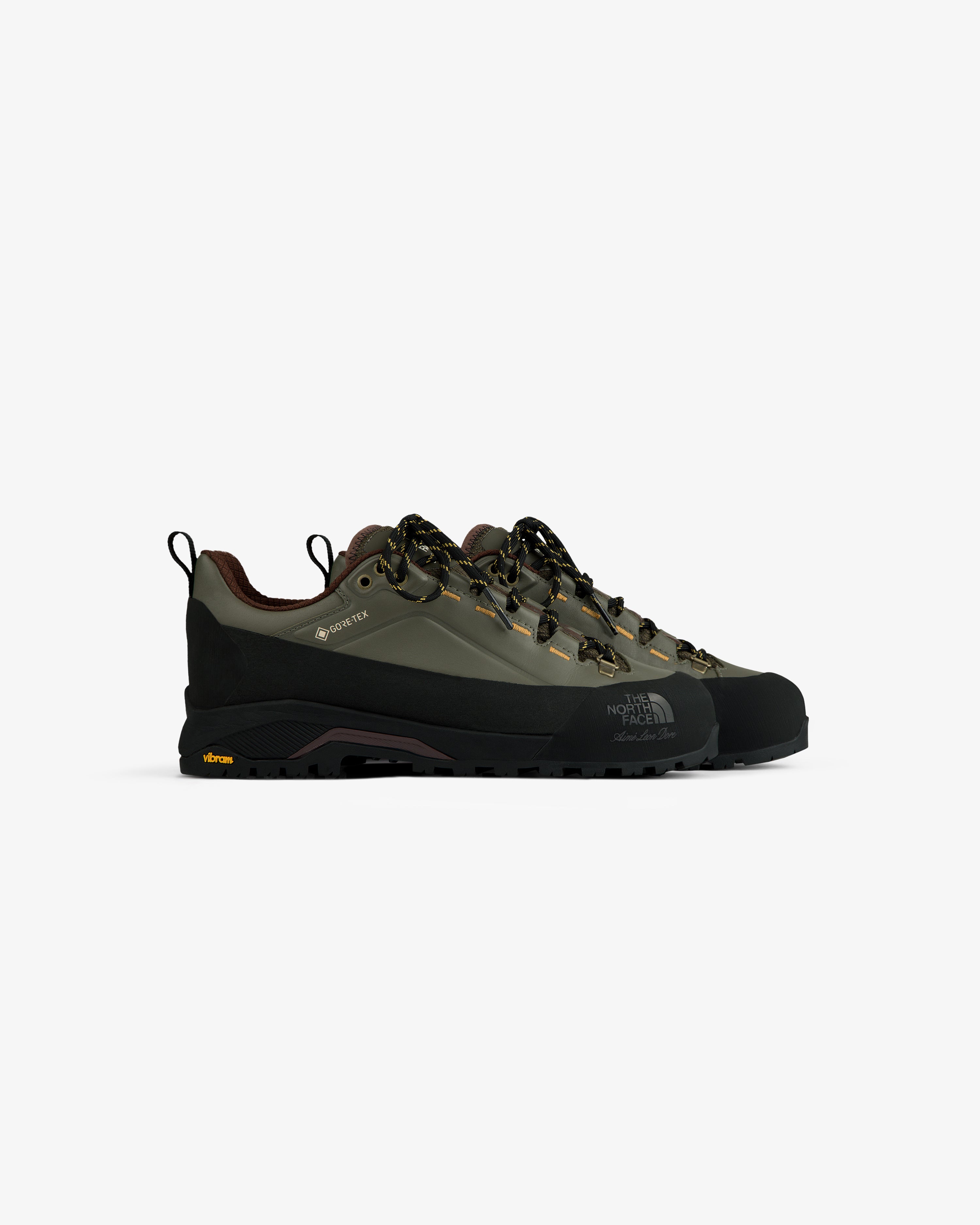 ALD/The North Face Verto Alpine GORE-TEX hiking shoes in olive green with black soles and yellow lace accents.