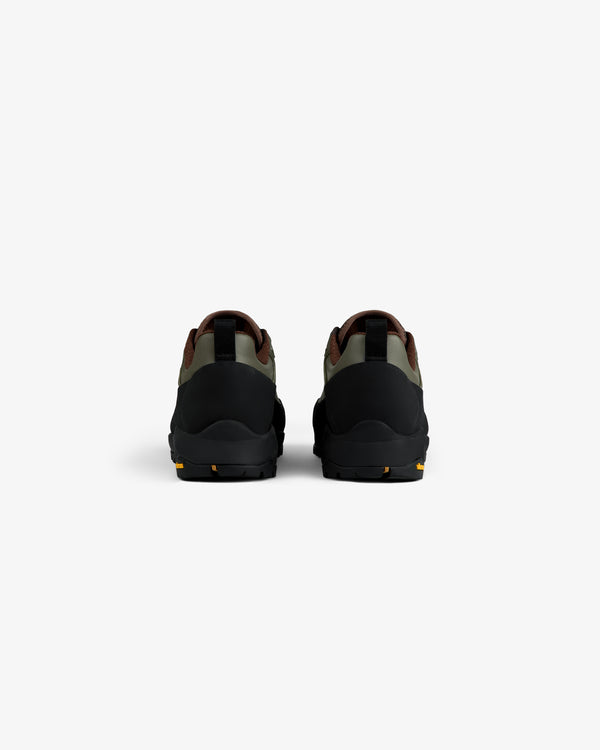 Back view of ALD/The North Face Verto Alpine GORE-TEX Hiking Shoes in black, green & brown on white background.