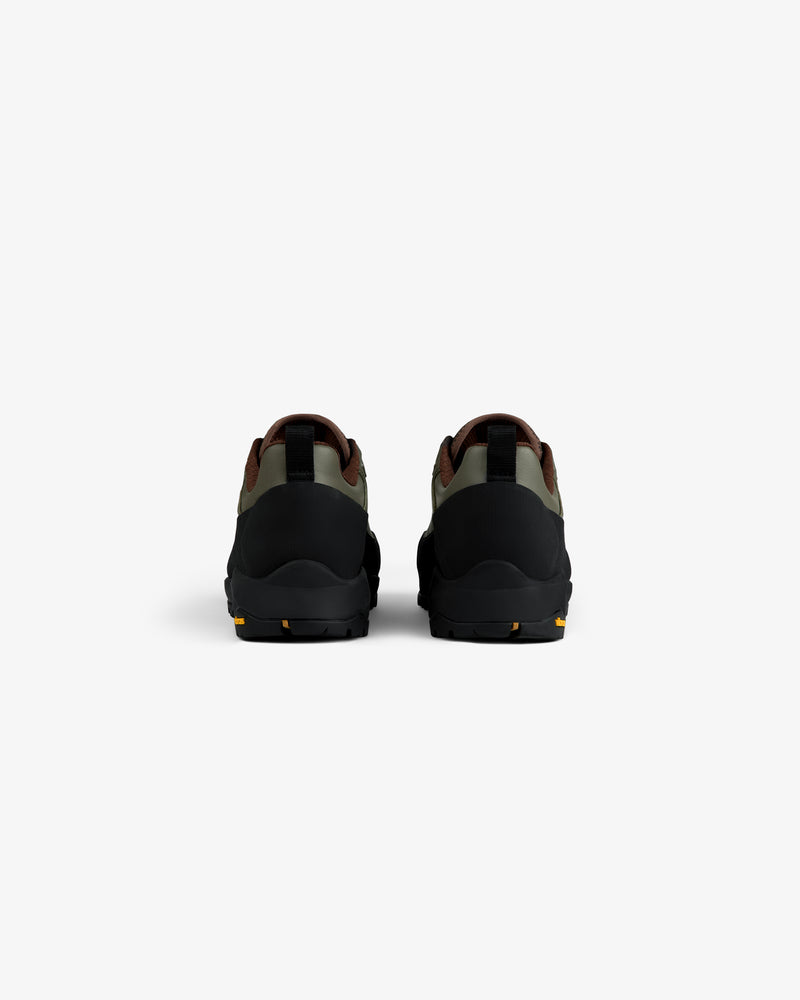 Back view of ALD/The North Face Verto Alpine GORE-TEX Hiking Shoes in black, green & brown on white background.