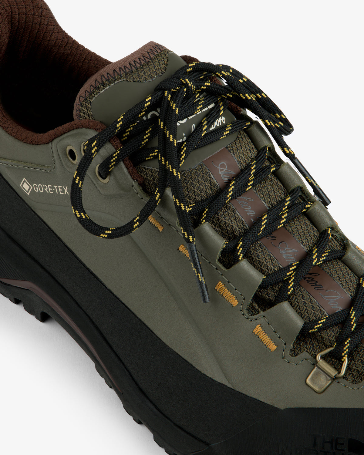 ALD/The North Face Verto Alpine GORE-TEX hiking shoe in olive green with black-yellow laces, brown accents, top view.