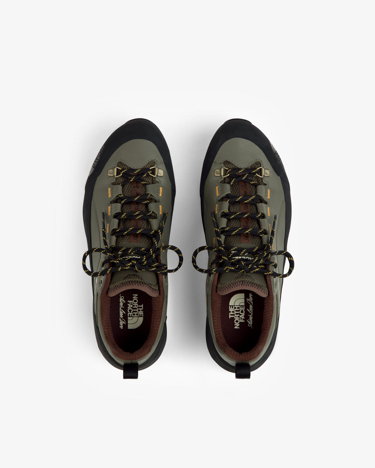 ALD/The North Face Verto Alpine GORE-TEX hiking shoes in green/black with yellow laces, top view on white background.