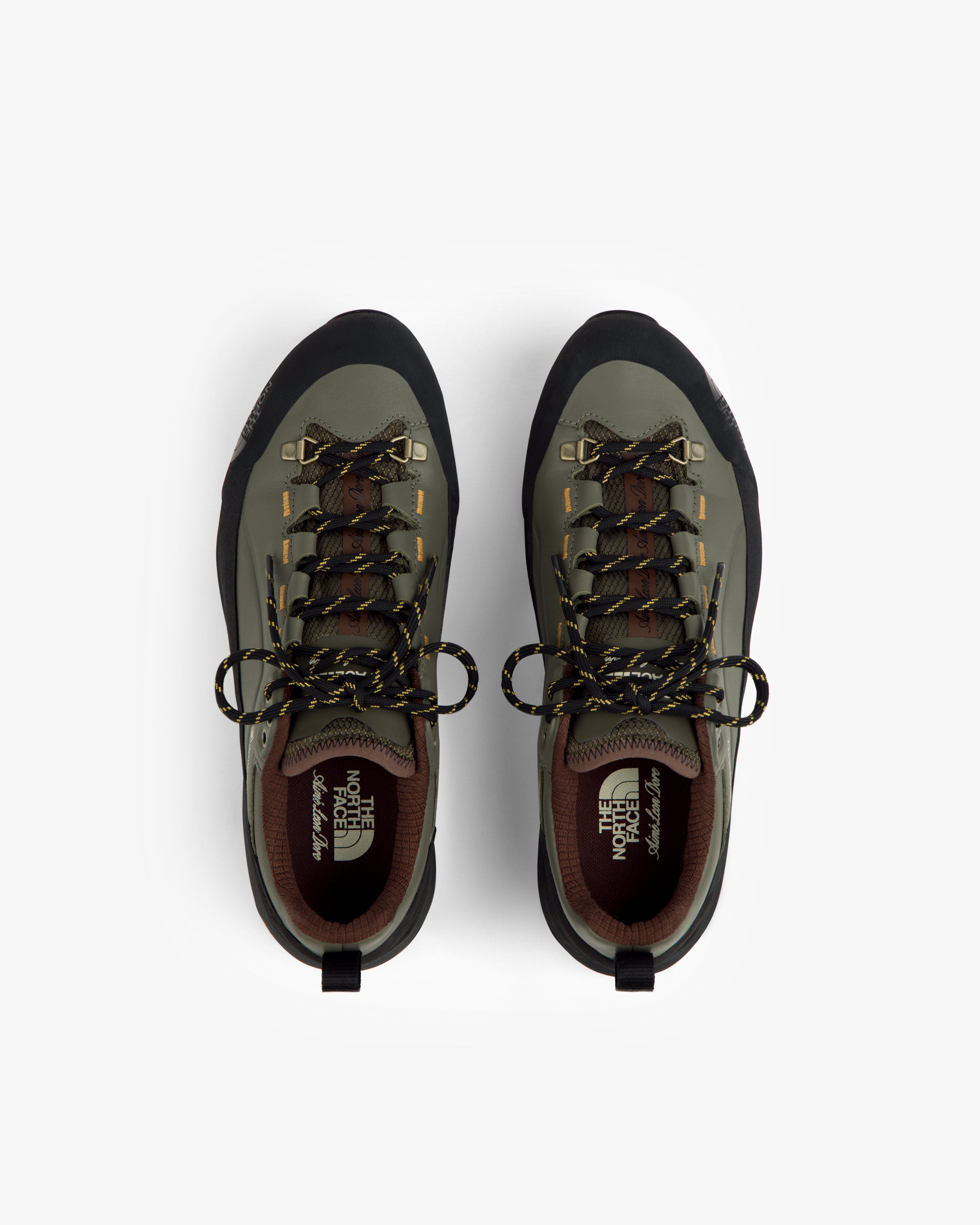 ALD/The North Face Verto Alpine GORE-TEX hiking shoes in green/black with yellow laces, top view on white background.