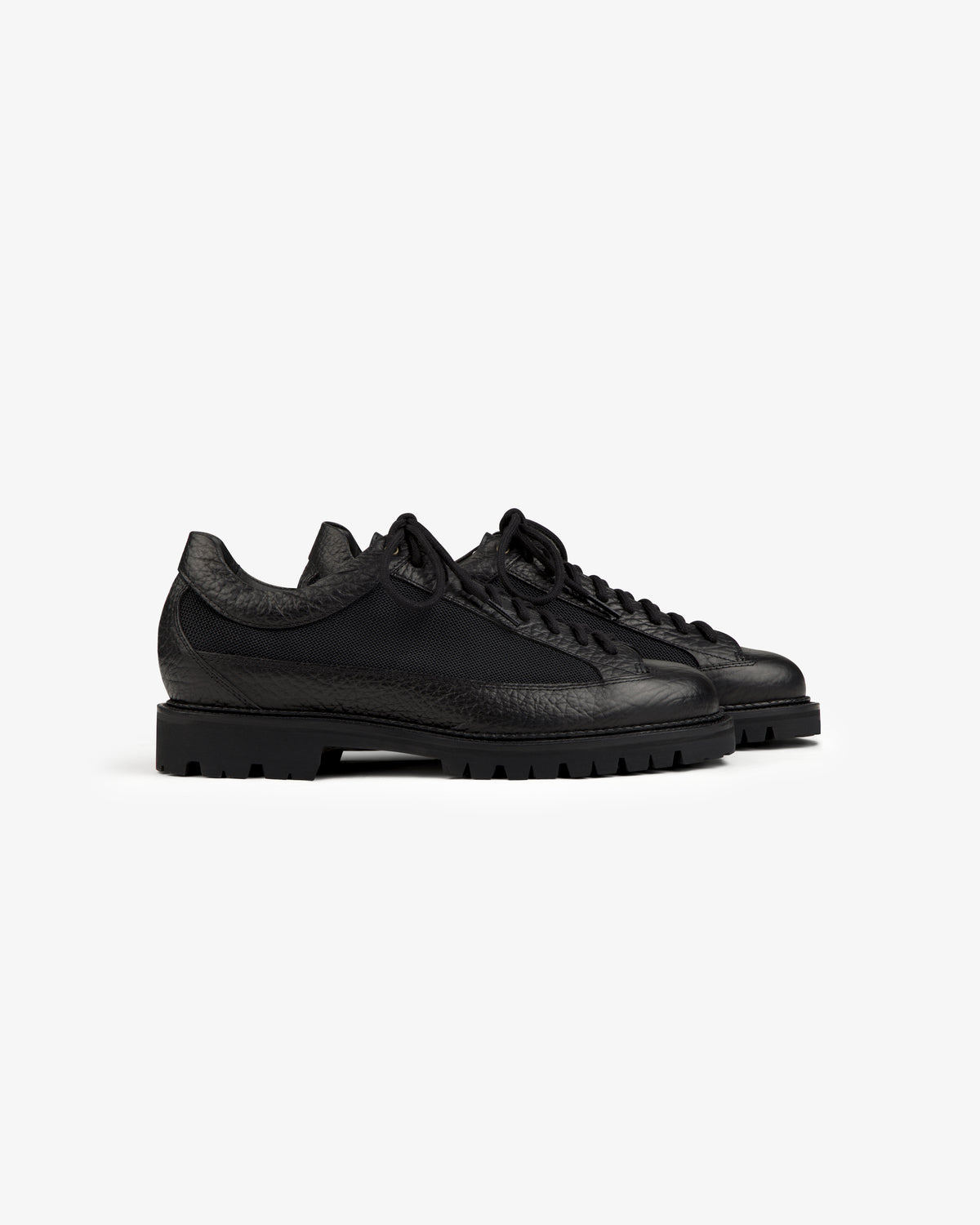 Black Field Boot low-top shoe with lace-up closure and a thick, treaded rubber sole.