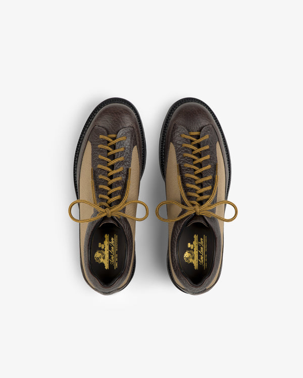Top-down view of brown and tan Field Boot lace-up boots with yellow laces.