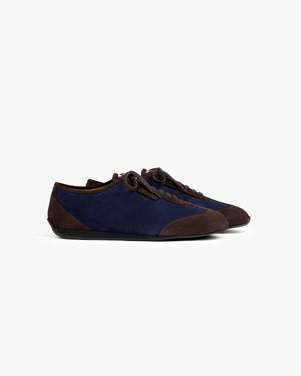 Low Profile Suede Trainer in navy and dark brown suede with a slim black sole and lace-up design.