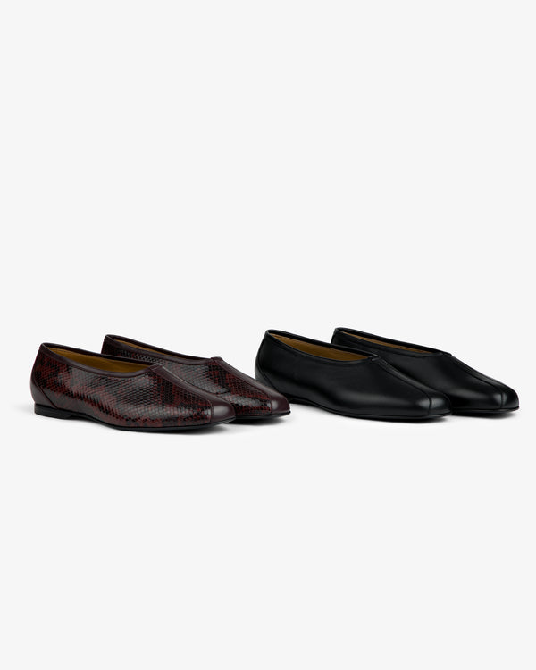 Two pairs of Leather Ballet Flats: one in black leather and one in a dark red textured pattern.