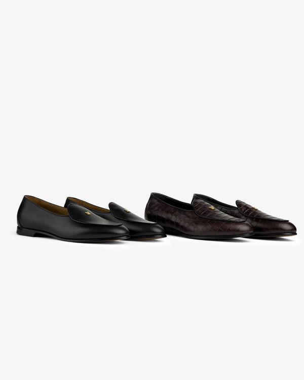 Two Crest Salóni loafers: one black leather, one dark brown woven, displayed on a white background.