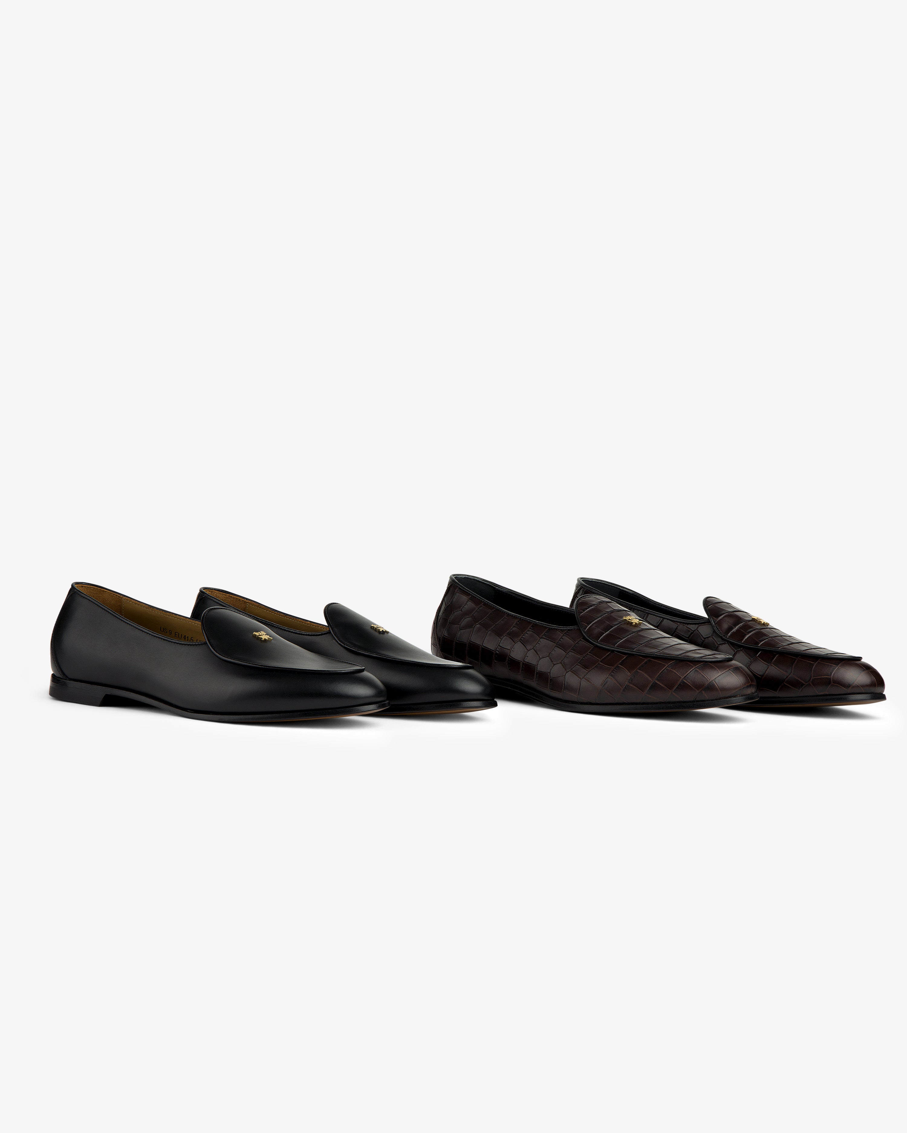 Two Croc-Embossed Crest Salóni Loafers, black leather and dark brown quilted, displayed on a white background.