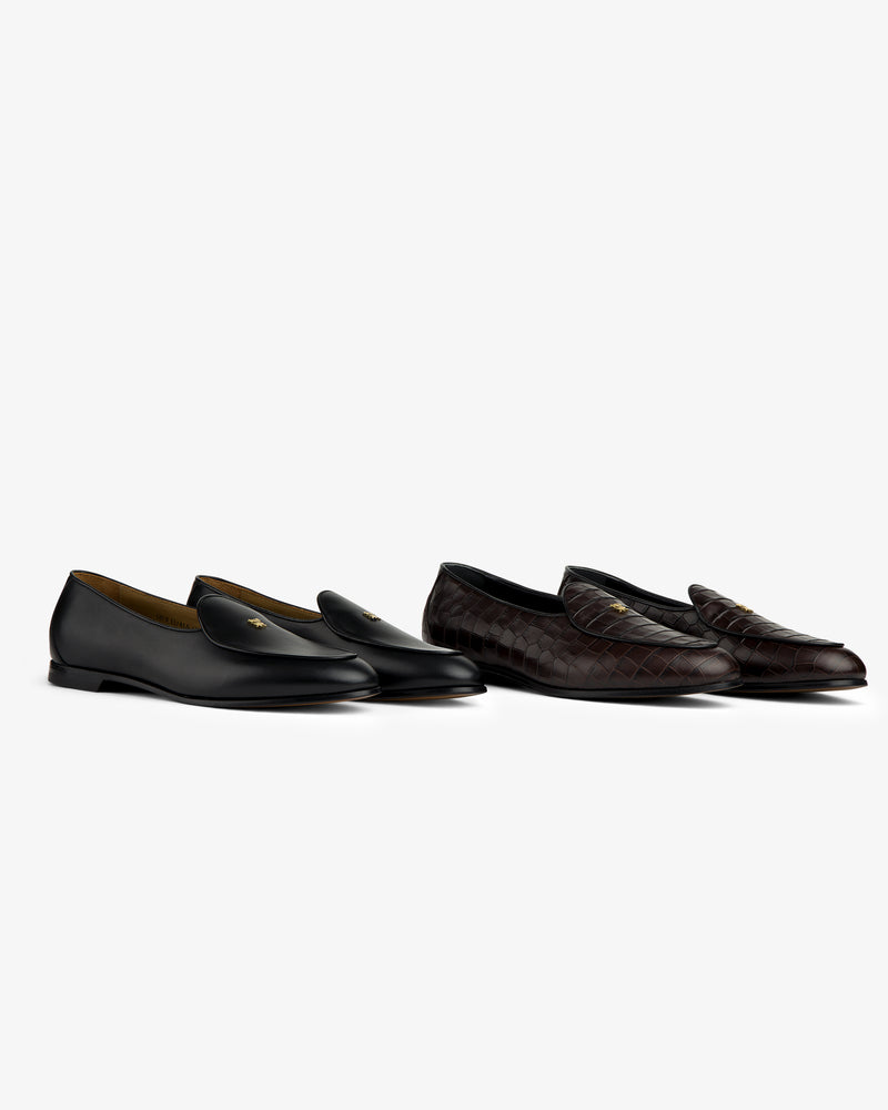 Two Croc-Embossed Crest Salóni Loafers, black leather and dark brown quilted, displayed on a white background.
