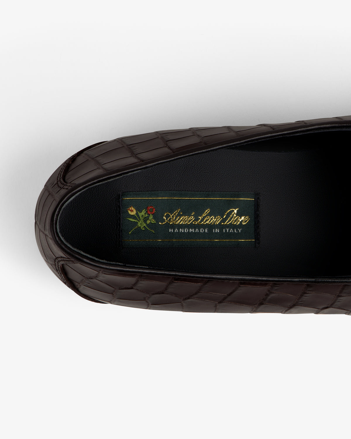 Brown croc-embossed leather Salóni Loafer with black insole labeled Sidone Lorusso Handmade in Italy and floral crest.