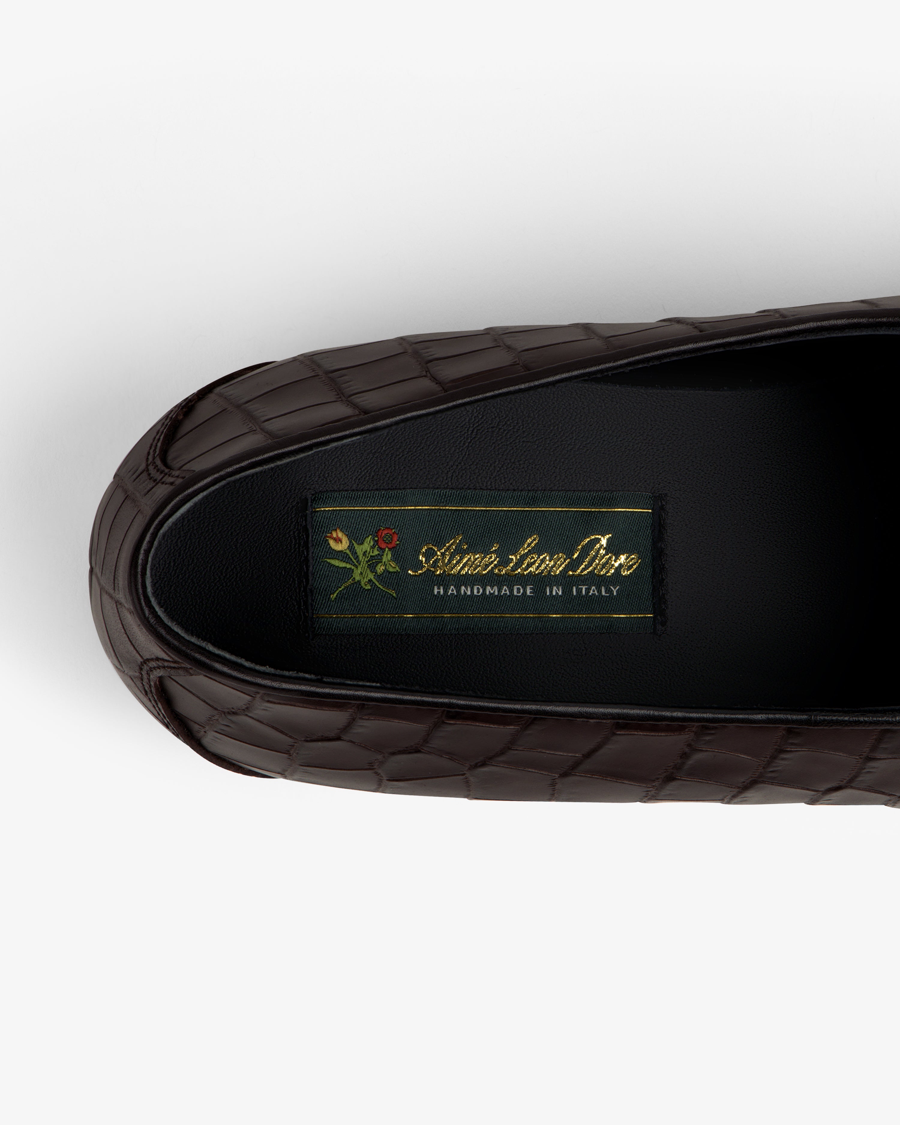 Brown croc-embossed leather Salóni Loafer with black insole labeled Sidone Lorusso Handmade in Italy and floral crest.