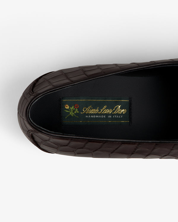 Brown croc-embossed leather Salóni Loafer with black insole labeled Sidone Lorusso Handmade in Italy and floral crest.