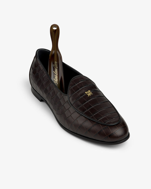 Croc-Embossed Crest Salóni Loafer in dark brown with a shoehorn at the heel, shown on a white background.