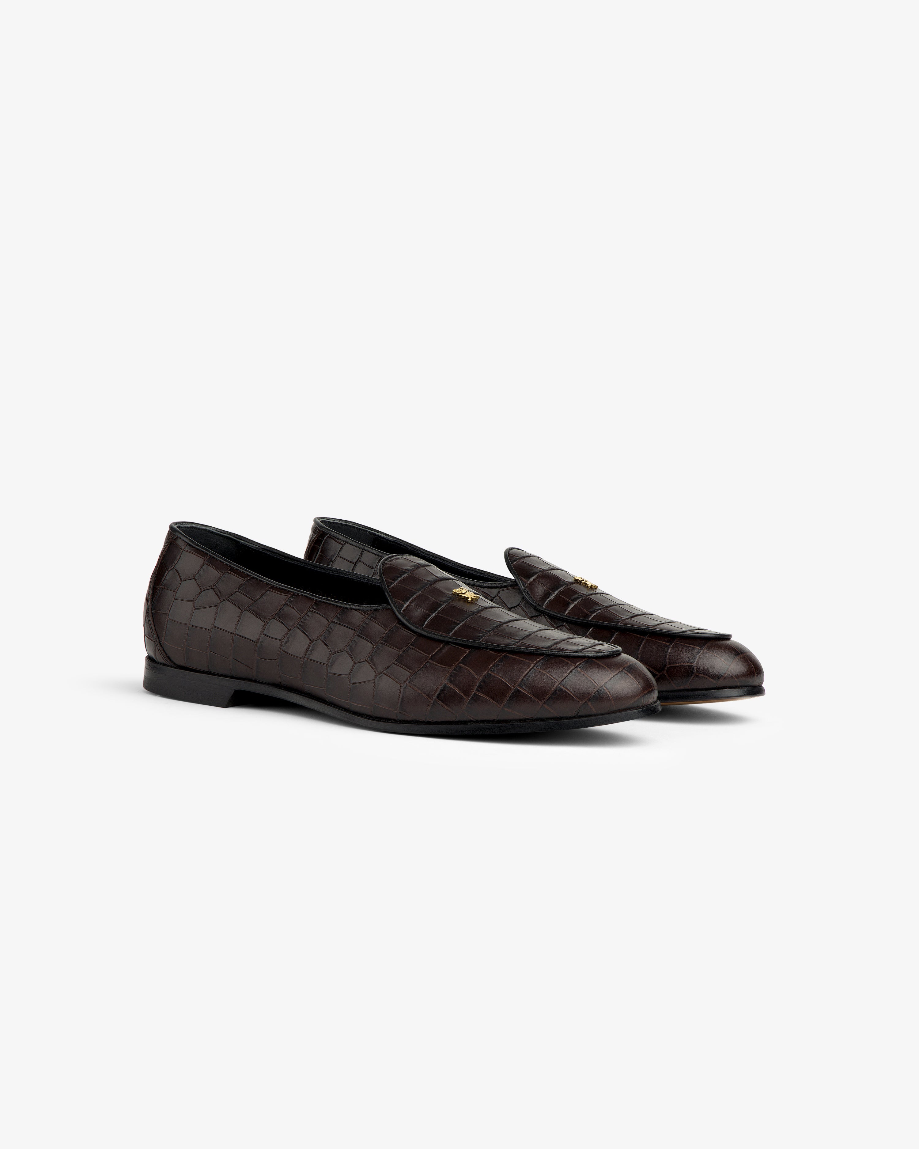 Croc-Embossed Crest Salóni Loafer in dark brown leather with gold accents, displayed on a light gray background.