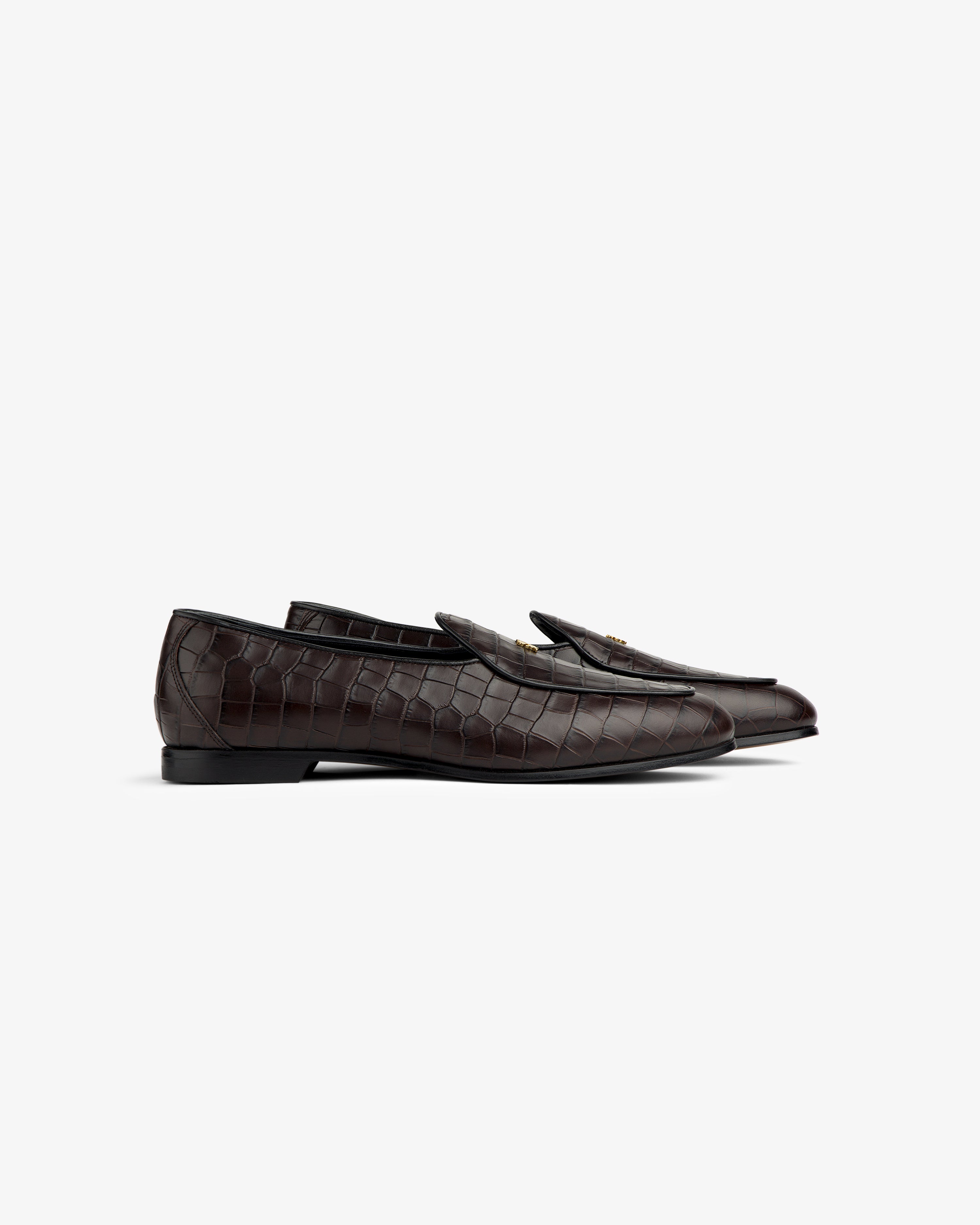 Croc-Embossed Crest Salóni Loafers in dark brown with gold buckle, side view on white background.