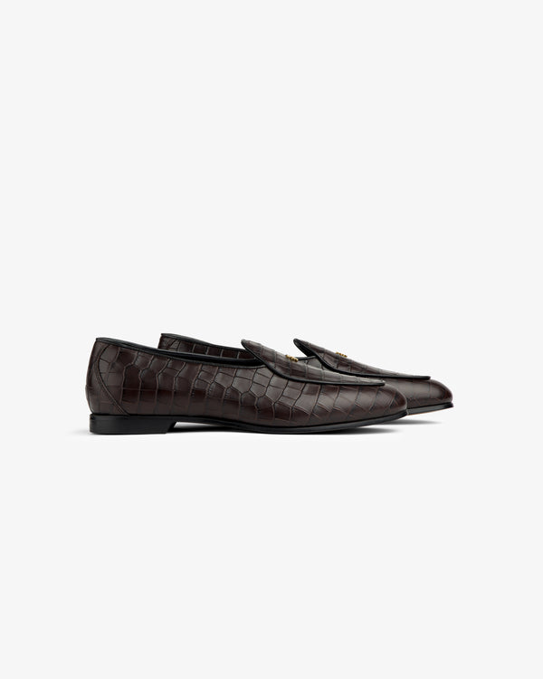 Croc-Embossed Crest Salóni Loafers in dark brown with gold buckle, side view on white background.