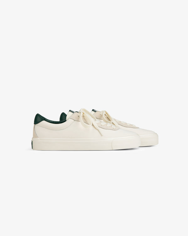 ALD / Last Resort AB VM001-LO Canvas off-white low-tops with green heel detail, displayed on white background.