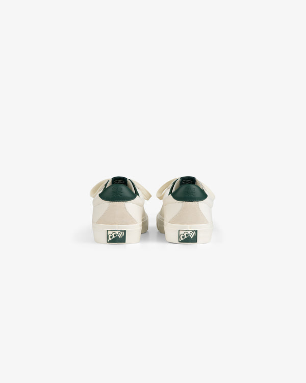 ALD / Last Resort AB VM001-LO Canvas white sneakers with green heel logo, back view on white background.