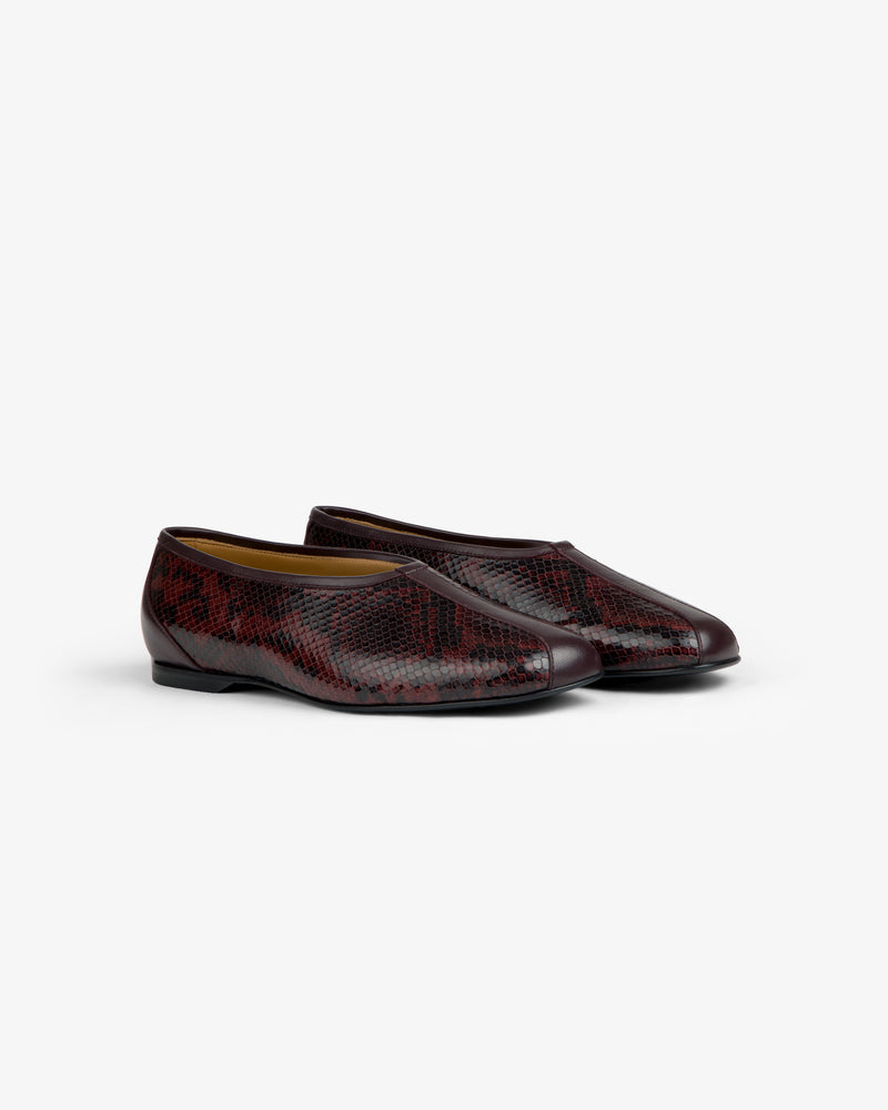 A pair of dark red Snake Print Leather Ballet Flat shoes.
