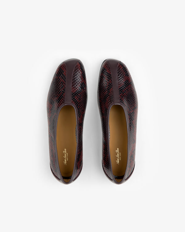 A pair of dark burgundy Snake Print Leather Ballet Flat shoes viewed from above.