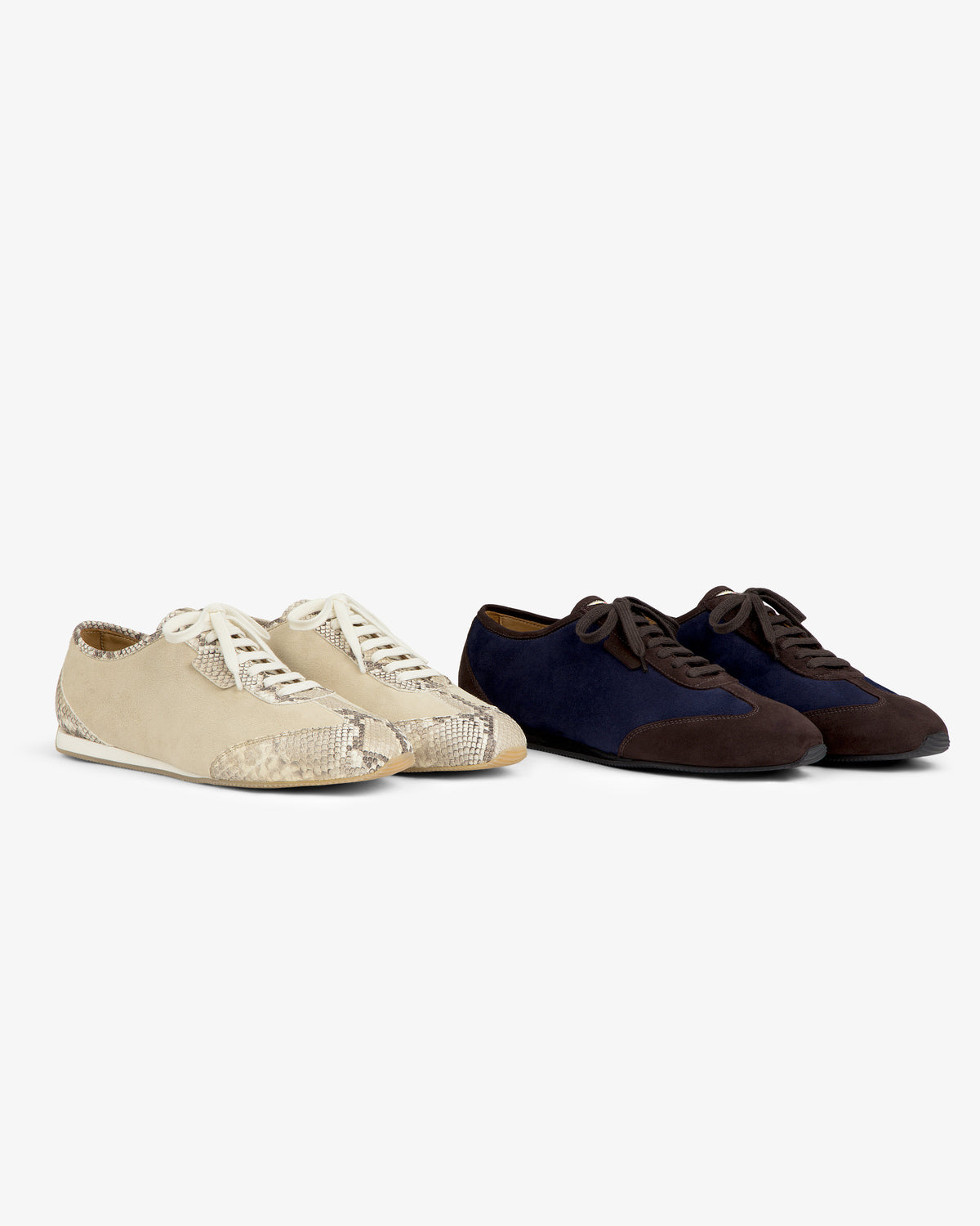 Snake Print Low Profile Suede Trainer in beige next to a pair of navy and brown suede trainers.