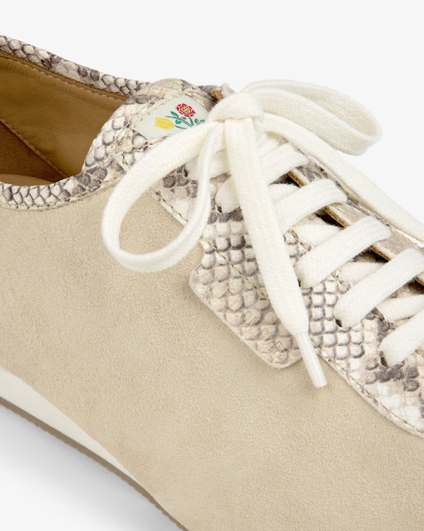 Snake Print Low Profile Suede Trainer in tan with snake-print accents, white laces, and a small floral tongue tag.